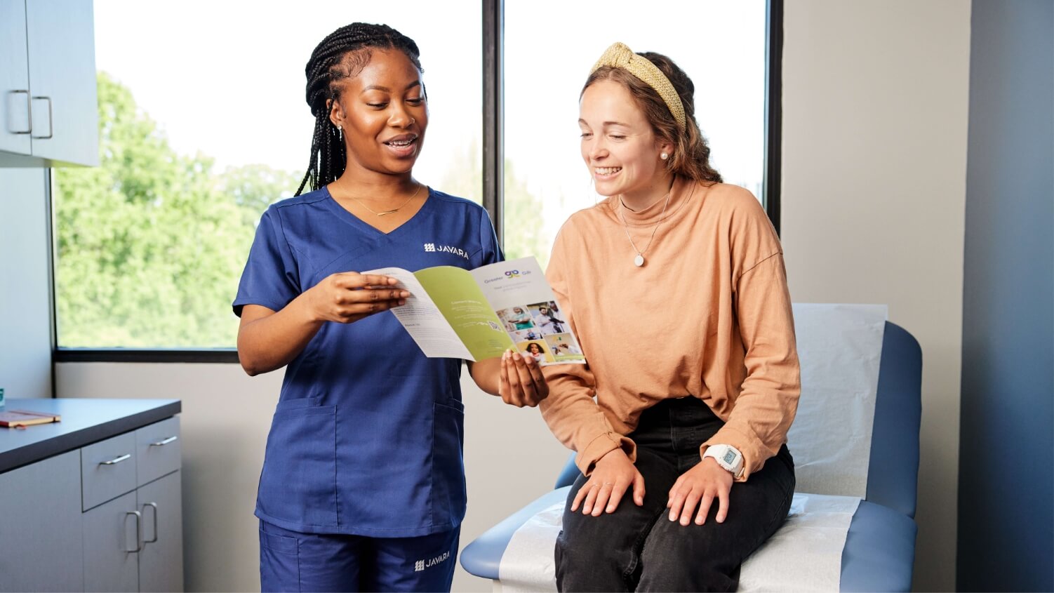 Javara employee with female patient