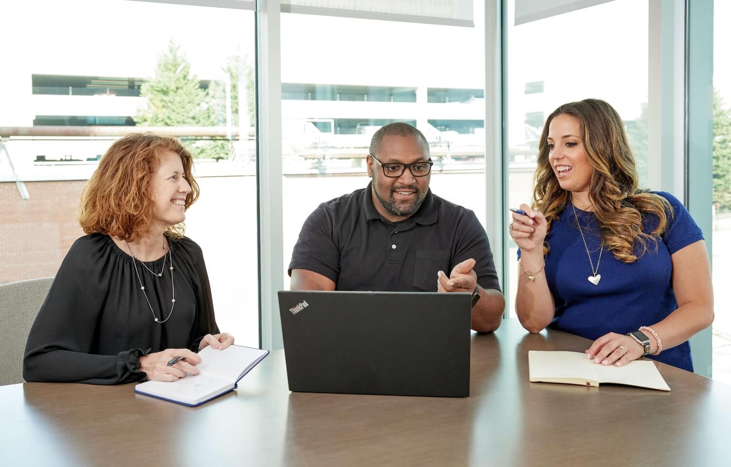 Javara employees meeting with a laptop