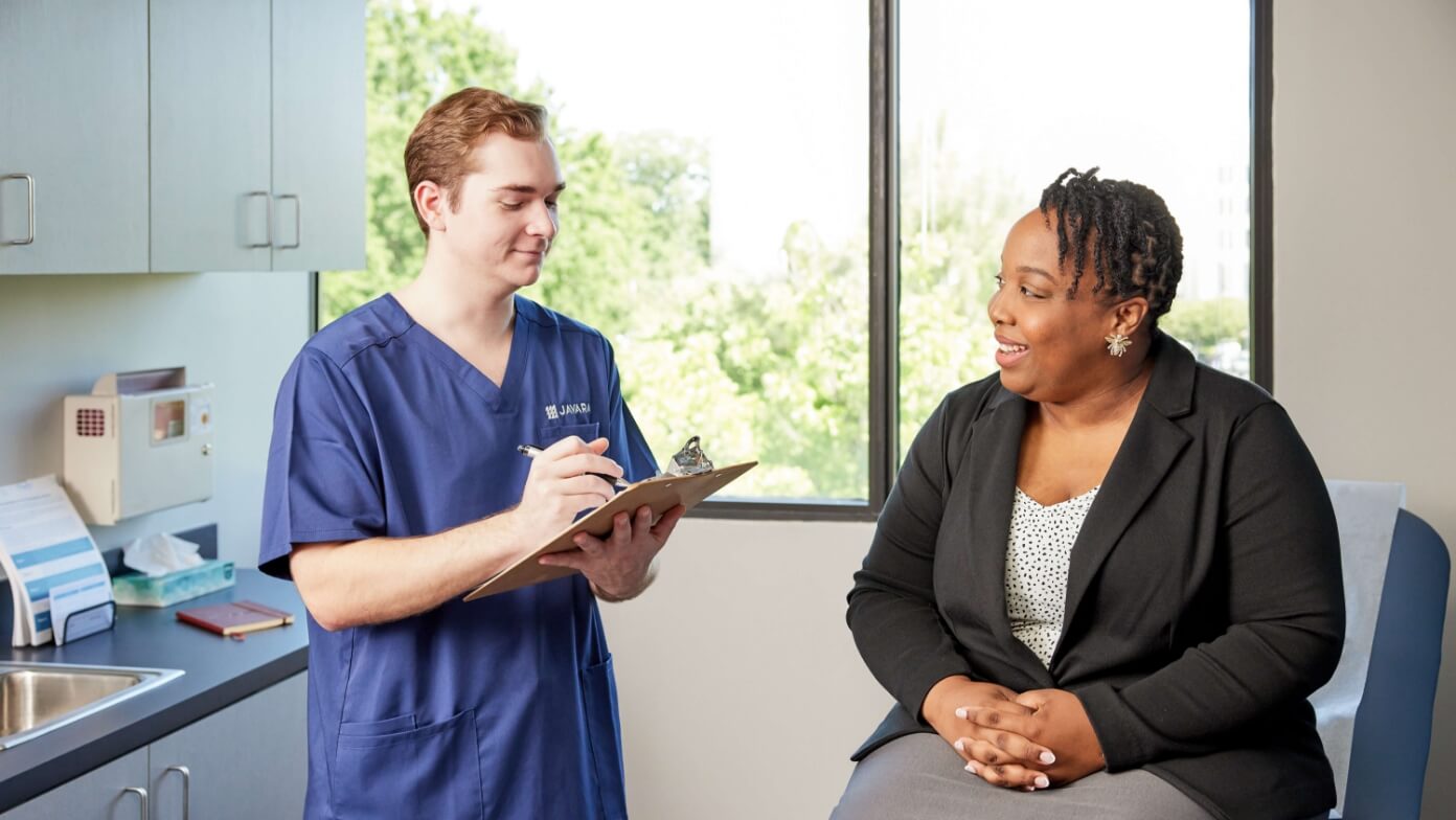 Javara employee talking to a patient