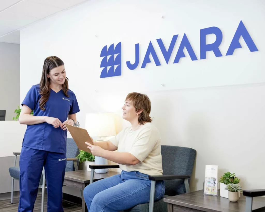 Nurse helping a patient with instructions in the doctor's office