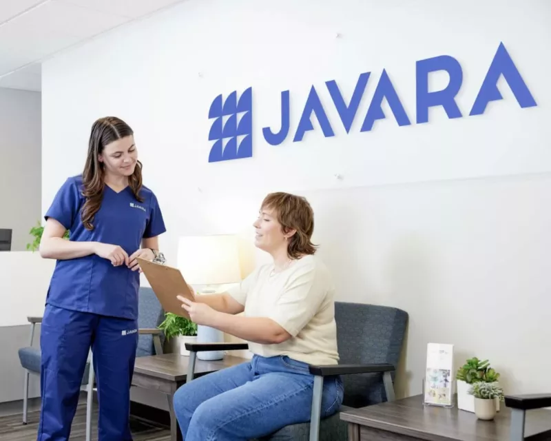 Nurse helping a patient with instructions in the doctor's office