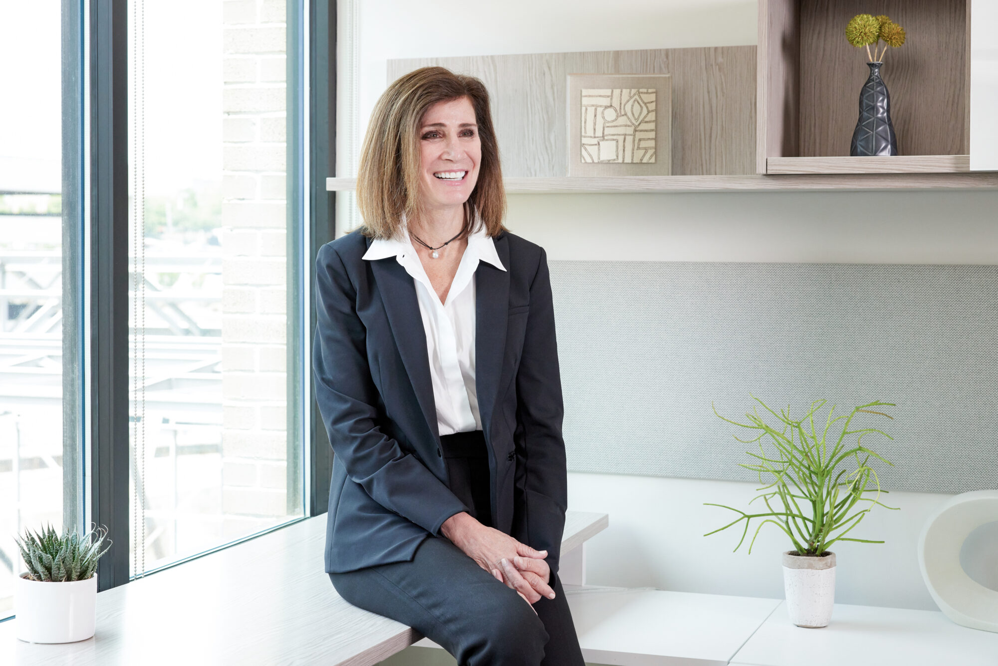 Portrait of Jennifer Byrne, Founder and CEO of Javara, whose leadership advances community-based clinical research, healthcare partnerships, embedded clinical trials, clinical research policy, and research site sustainability.